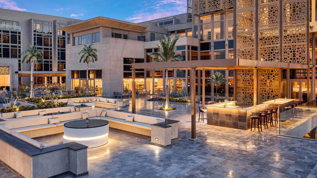 Hotel courtyard with Egyptian architectural detail, evening lighting