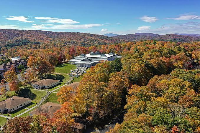 Art of Living Retreat Center surrounded by autumn forest in the Blue Ridge Mountains
